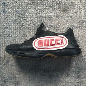 Black Gucci Rhyton Sneakers with Sega logo.
